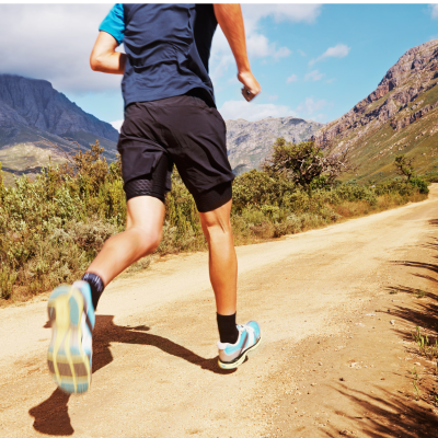 Closeup of a man running in mountainous area, representing how exercise strengthens the heart