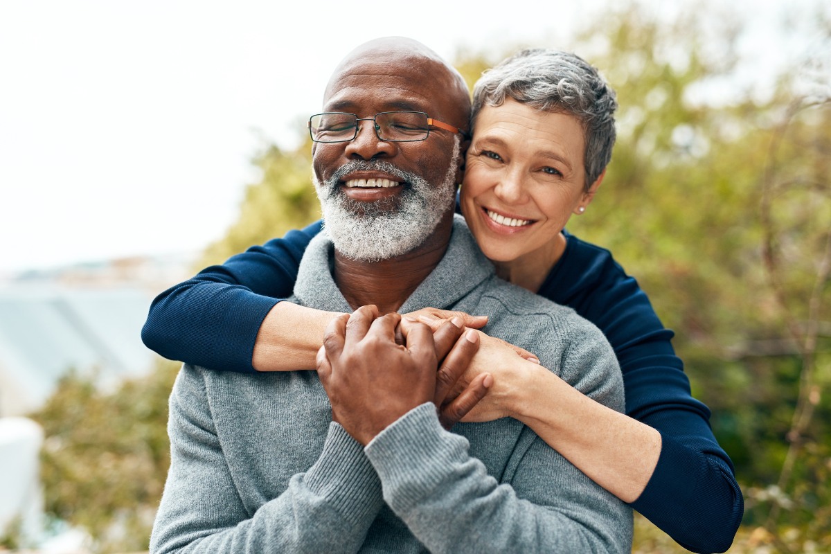 oracle-heart-and-vascular-spotsylvania Happy senior couple embracing outdoors representing heart health patients at Oracle Heart & Vascular in Spotsylvania, Virginia