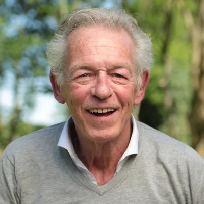 Cholesterol management for better heart health 3 Older man smiling outside, representing cholesterol management
